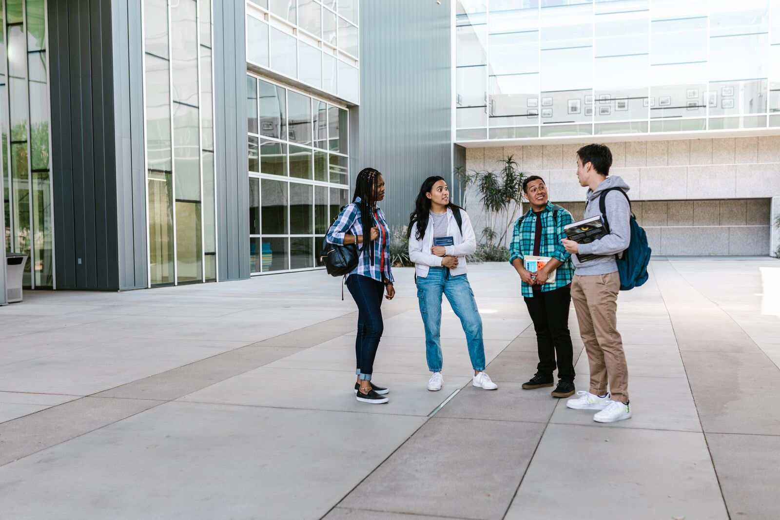 International students talking outside a university campus building