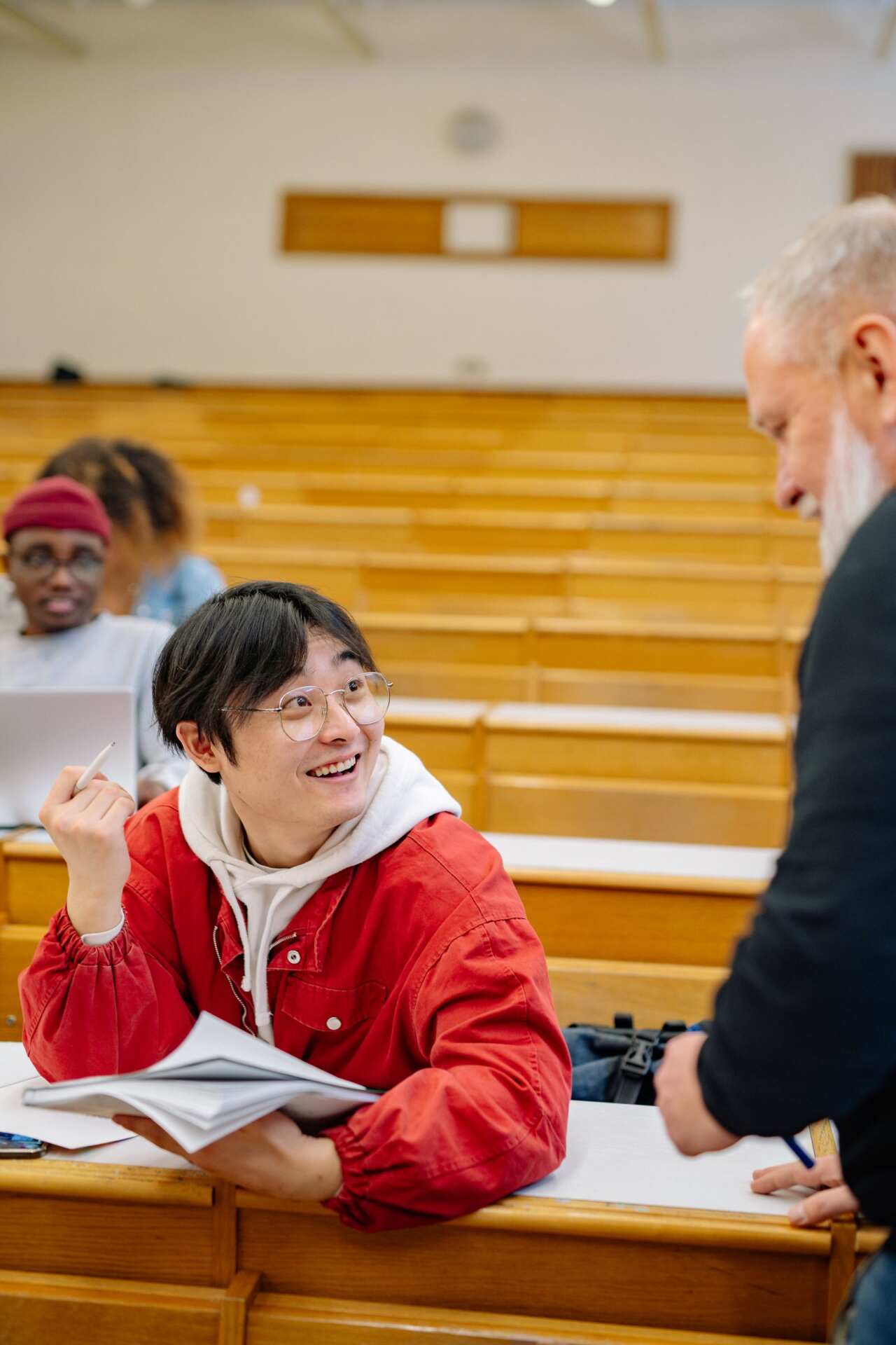 Professor teaching students in a university lecture hall